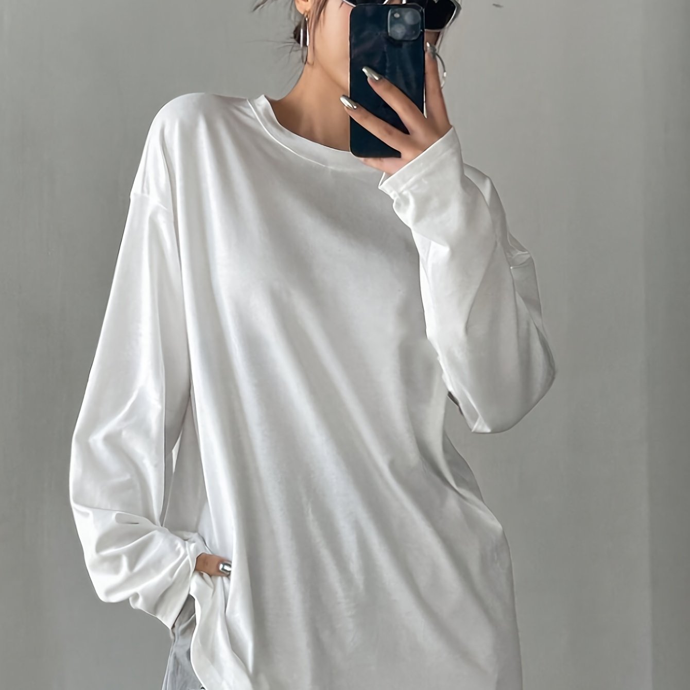 Women's casual crew neck long sleeve t-shirt in white, made of 62% polyester, 34% viscose, and 4% elastane. Regular fit with medium stretch, suitable for fall/winter fashion.