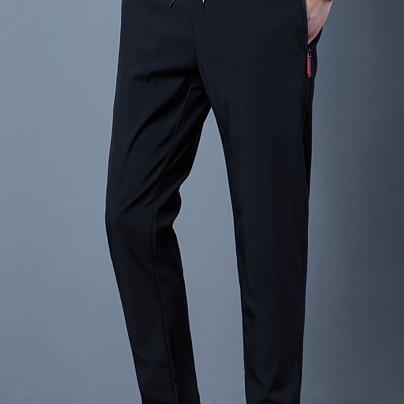 Casual men's pants with stretch, drawstring and zipper for spring and summer sports.