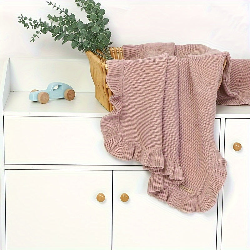 Soft and cozy, the Mimixiong Solid Color Acrylic Knit Blanket with Ruffle Trim is the perfect hand wash-only throw for autumn and winter.