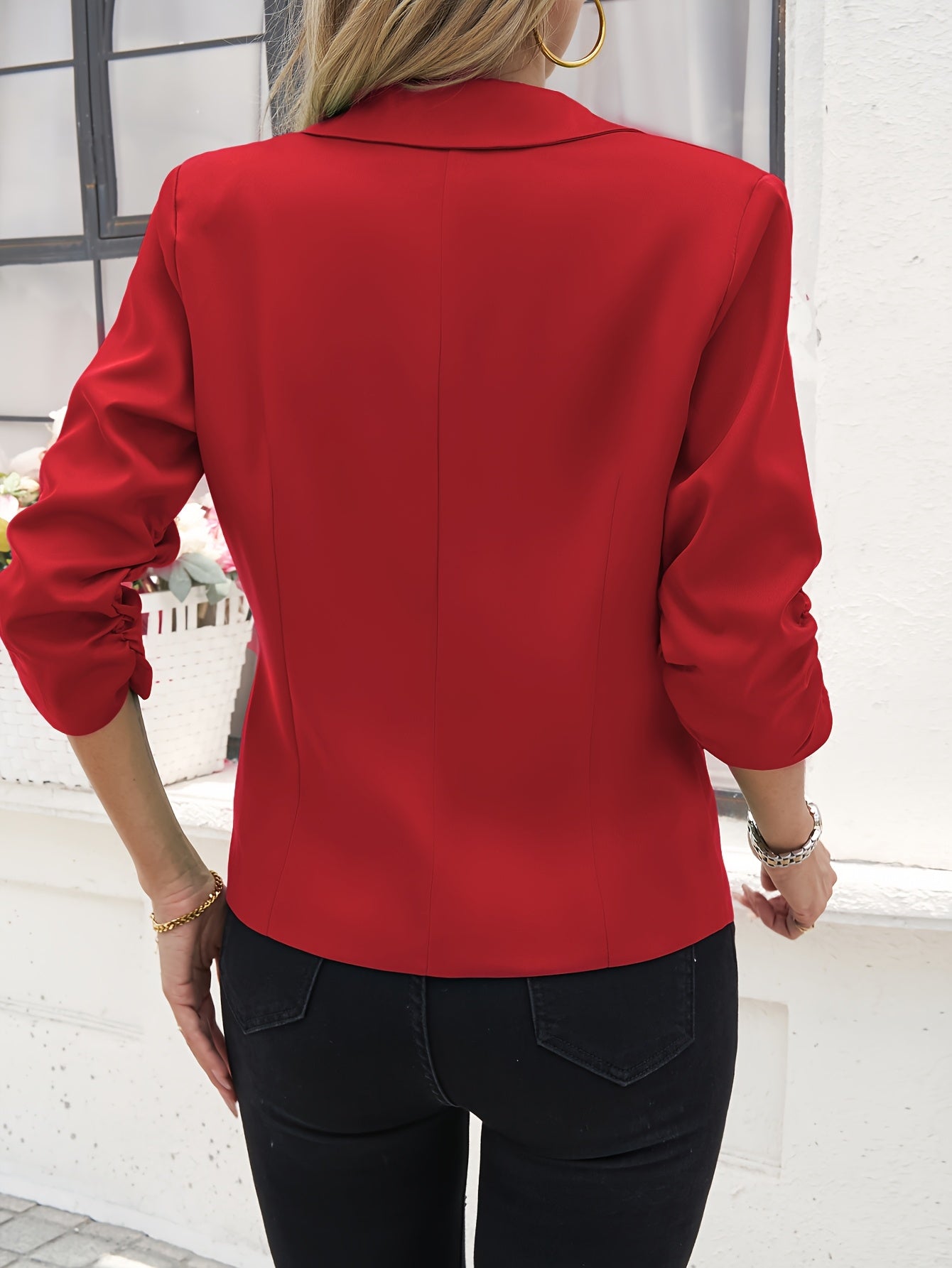 Women's slim-fit casual blazer with a single button placket, roll-up sleeves, and polyester lining for spring/fall season.