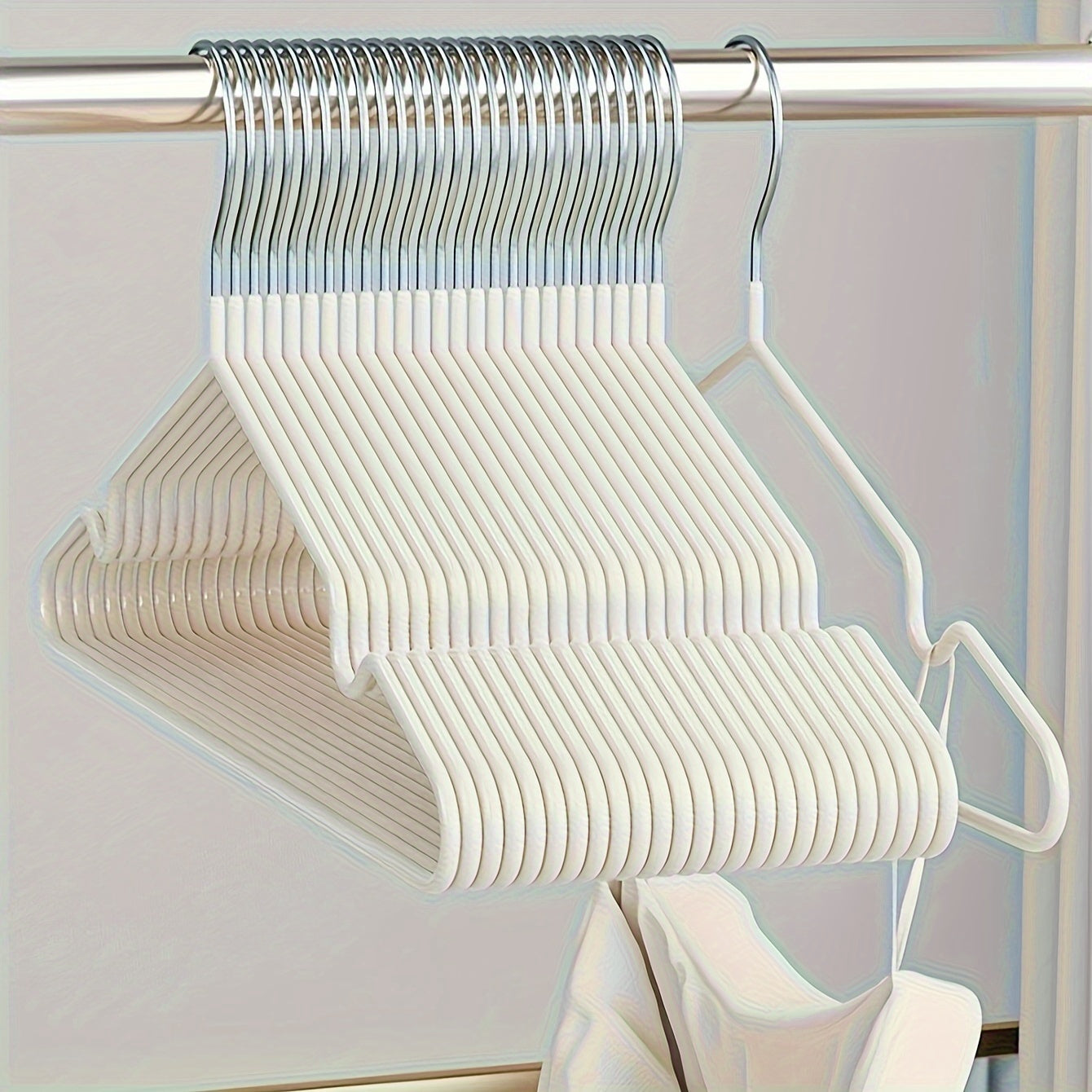 Essential for any home wardrobe, these durable non-slip metal hangers come in a convenient 10-pack. Featuring shoulder grooves to keep clothing in place, these space-saving hangers are perfect for hanging tops and dresses.