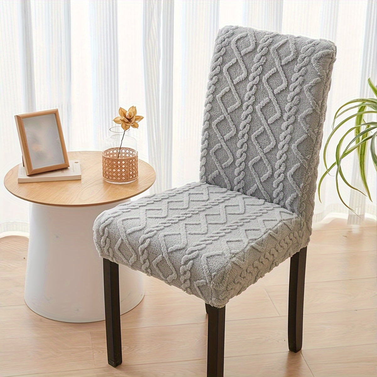 Elastic chair cover with double-sided jacquard design for home decor.