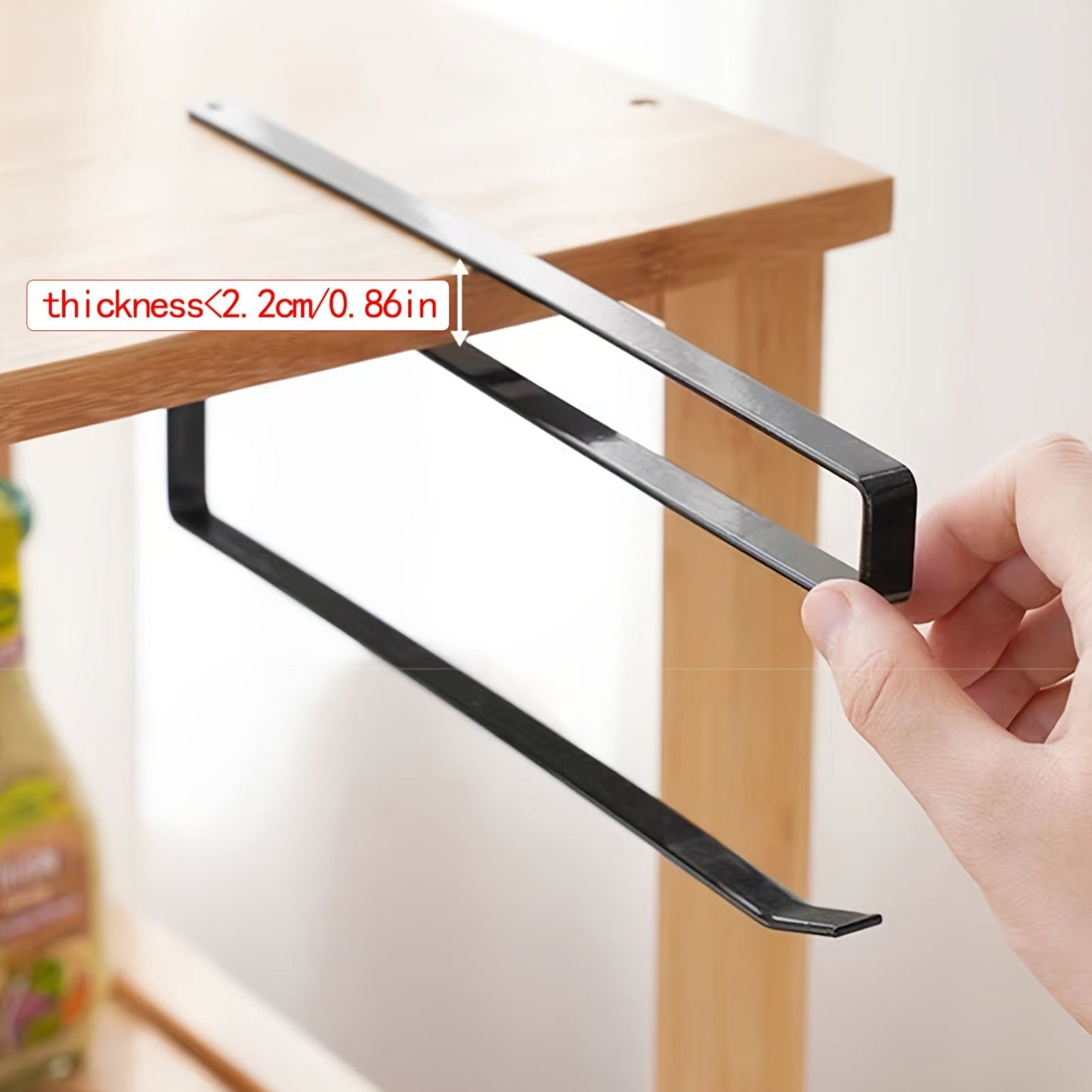 Easy to install under-cabinet paper towel holder, made of space-saving metal rack for kitchen use. Ideal for holding dishcloths and oil-absorbing sheets, no drilling necessary. Sleek metal design with iron construction, perfect for organizing kitchen