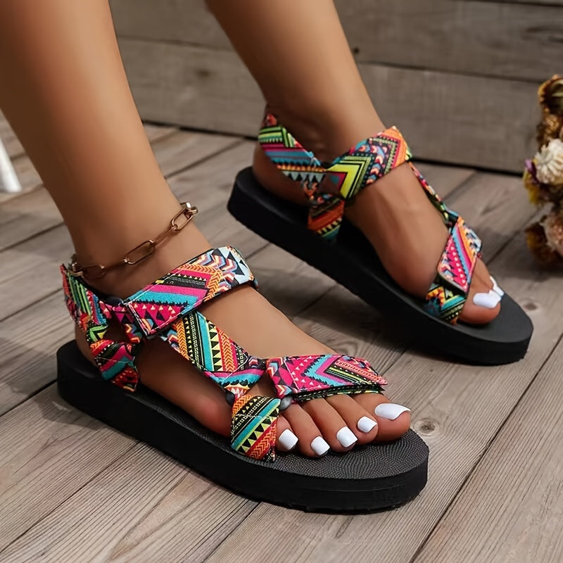 Flat sandals with tribal pattern, open toe and lightweight design for casual summer wear.