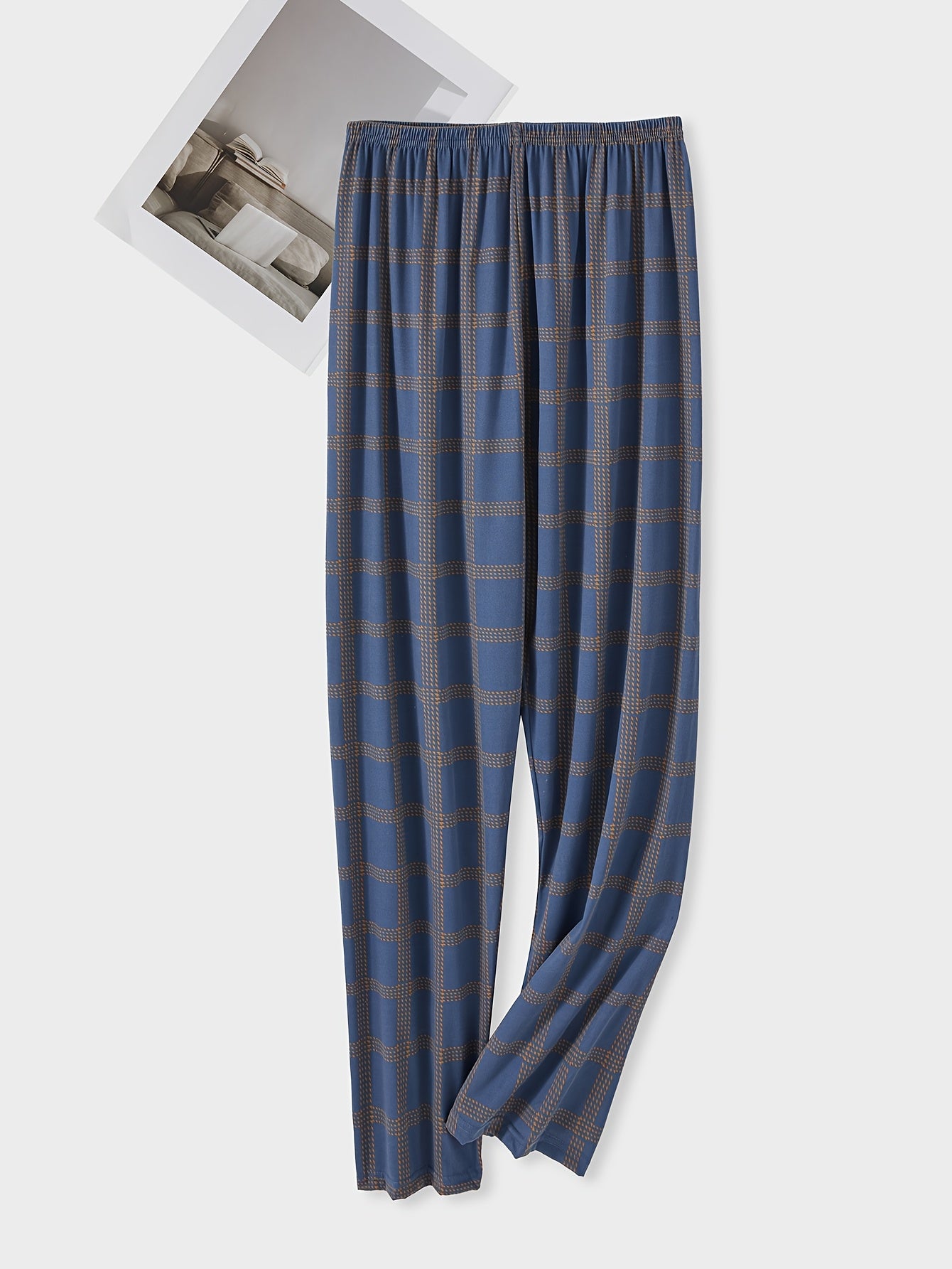 Men's plaid pajama pants in blue and brown, cozy polyester with elastic waistband. Suitable for spring/fall, comfortable and machine washable. Features checkered pattern and knitted weave.