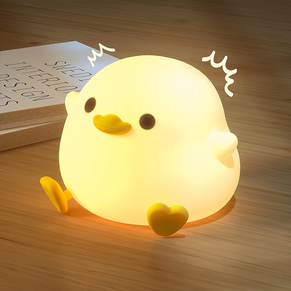 Cute duck-shaped touch control night light with RGB color changing, soft silicone bedside lamp, USB-C rechargeable desk light, perfect gift for any room.