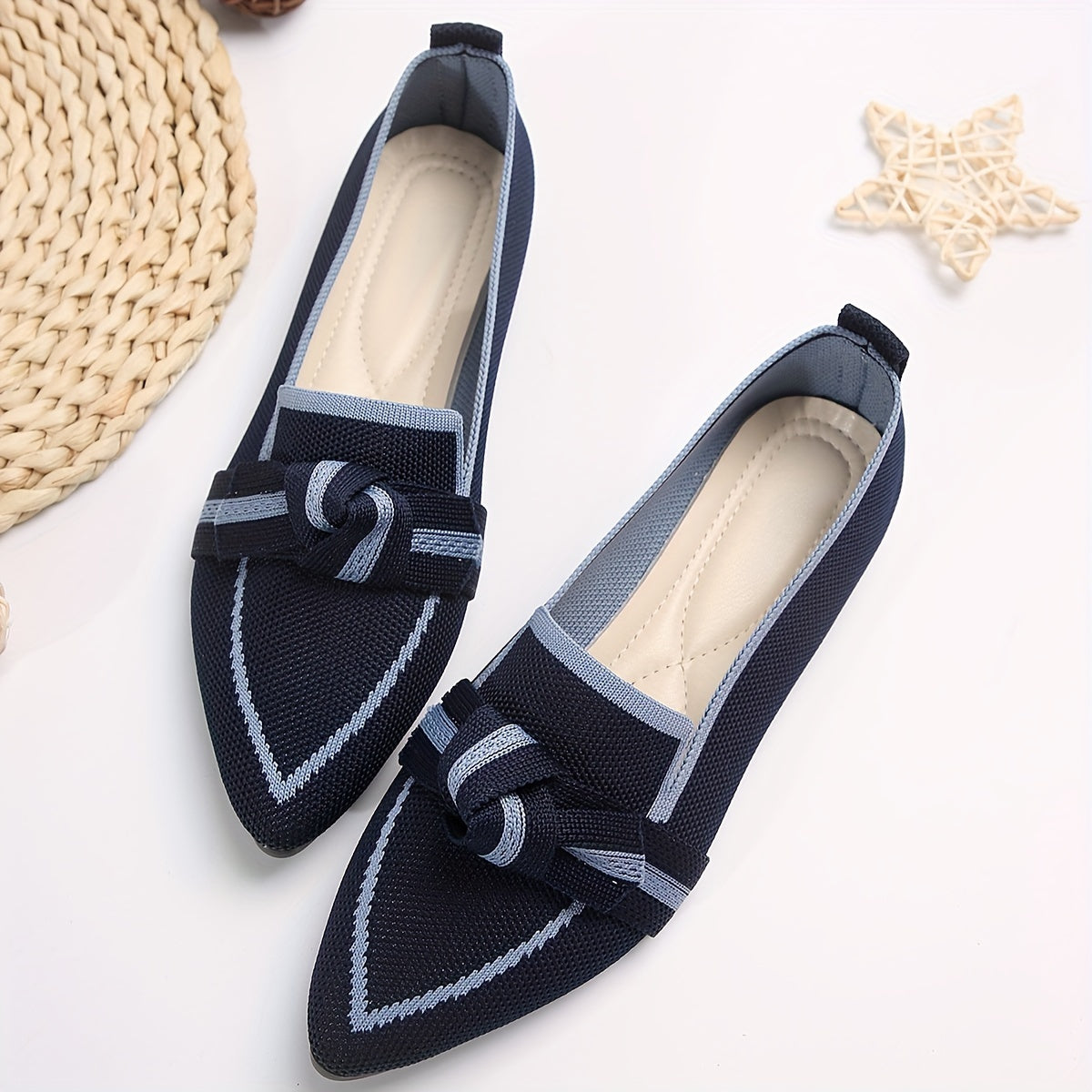 Stylish slip-on flat shoes with knot design and pointed toe for everyday comfort and breathability.