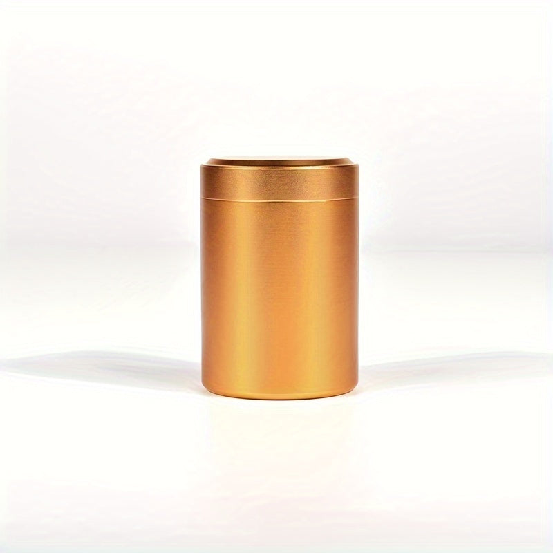 A compact stainless steel tea canister with sealed storage, ideal for on-the-go use. Packaged in a gift box, this household essential is perfect for storing tea on your travels.