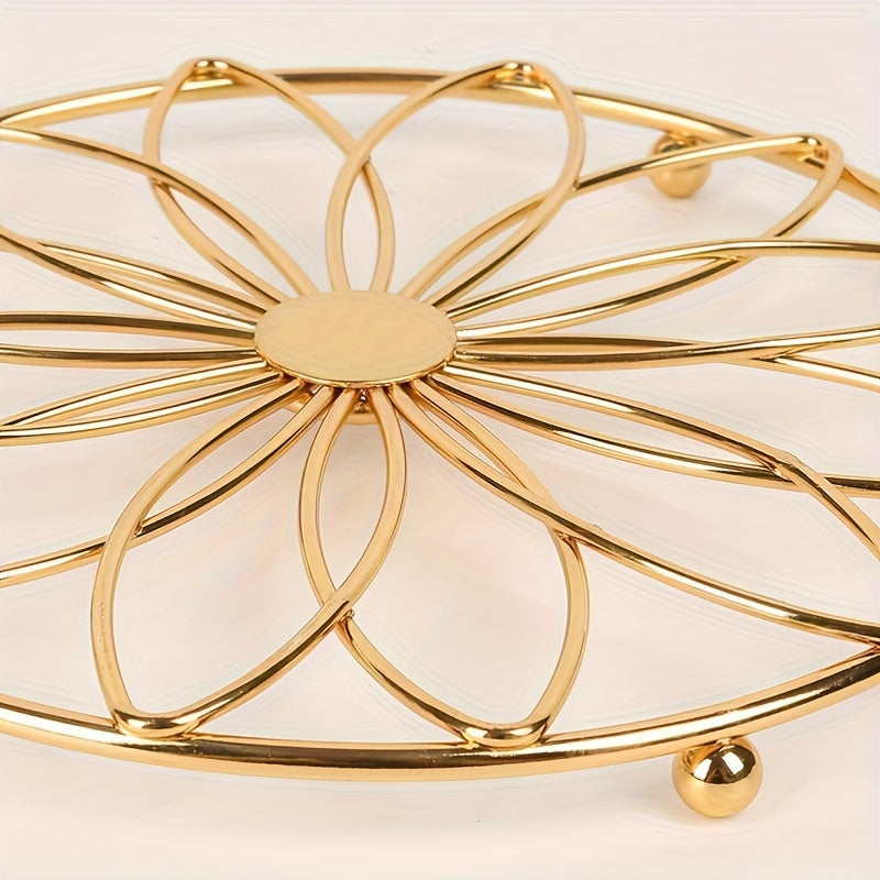 This stylish trivet features a decorative hollow flower design and is made of durable stainless steel. It is heat-resistant and non-slip, making it the perfect accessory for your dining and kitchen countertops. Ideal for Halloween and Christmas parties