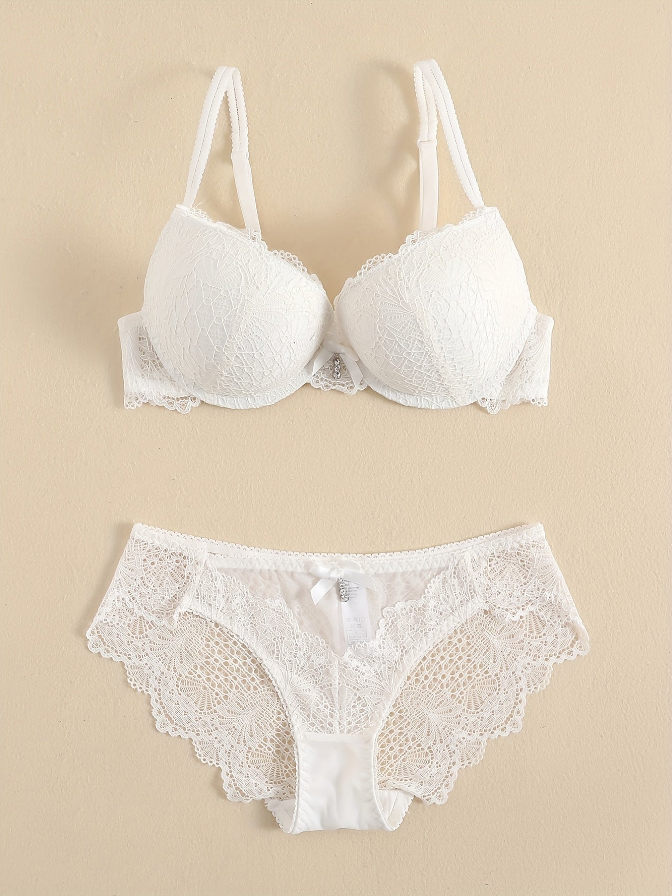 Floral lace lingerie set featuring a sexy push-up lace bra and bow tie panties for women.