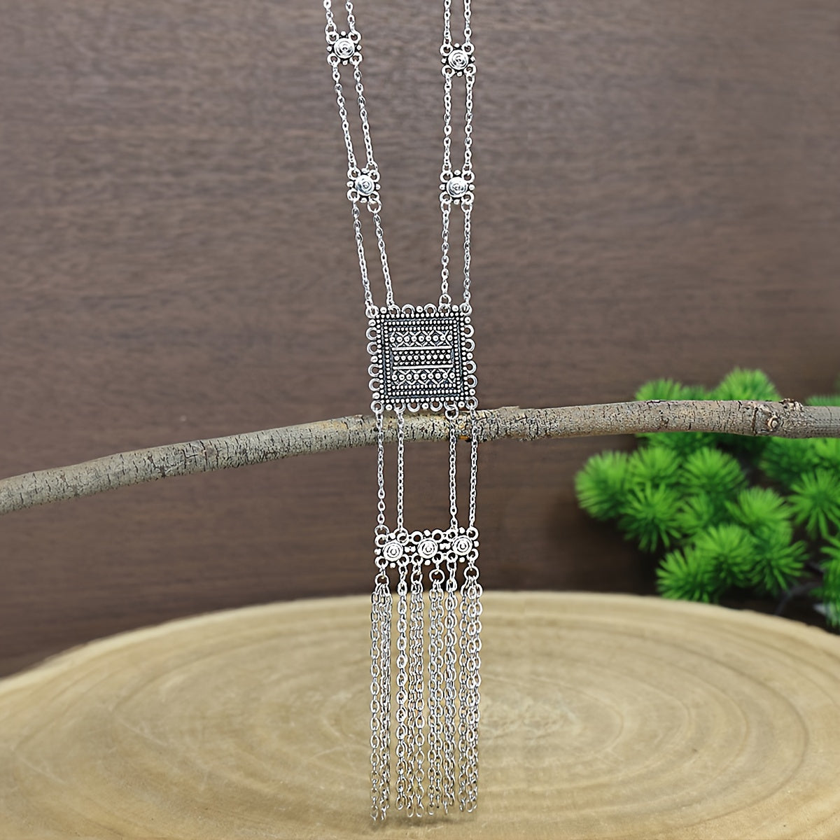 This retro ethnic style women's jewelry set includes three pieces: a geometric zinc alloy necklace and matching tassel long earrings. The set is simple, stylish, and versatile, suitable for all seasons and can be paired with a long skirt or sweater.