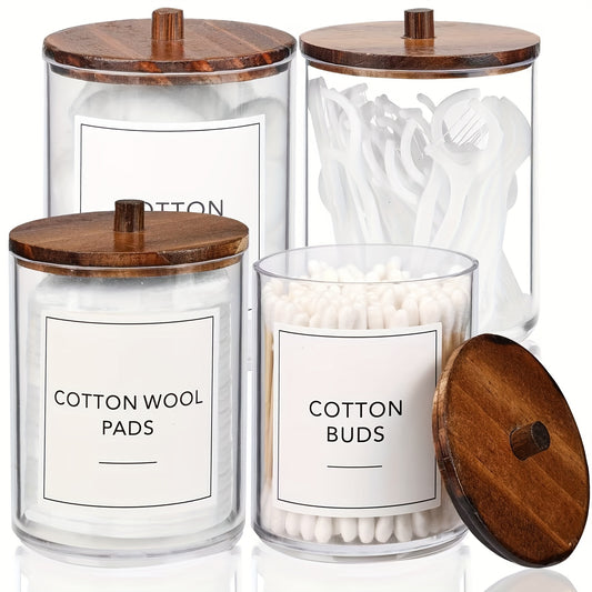 4-pack of vintage-style 10 oz clear plastic apothecary jars with window view and wooden lids for bathroom storage and organization. Ideal for swabs, pads, buds, floss, and other small items.