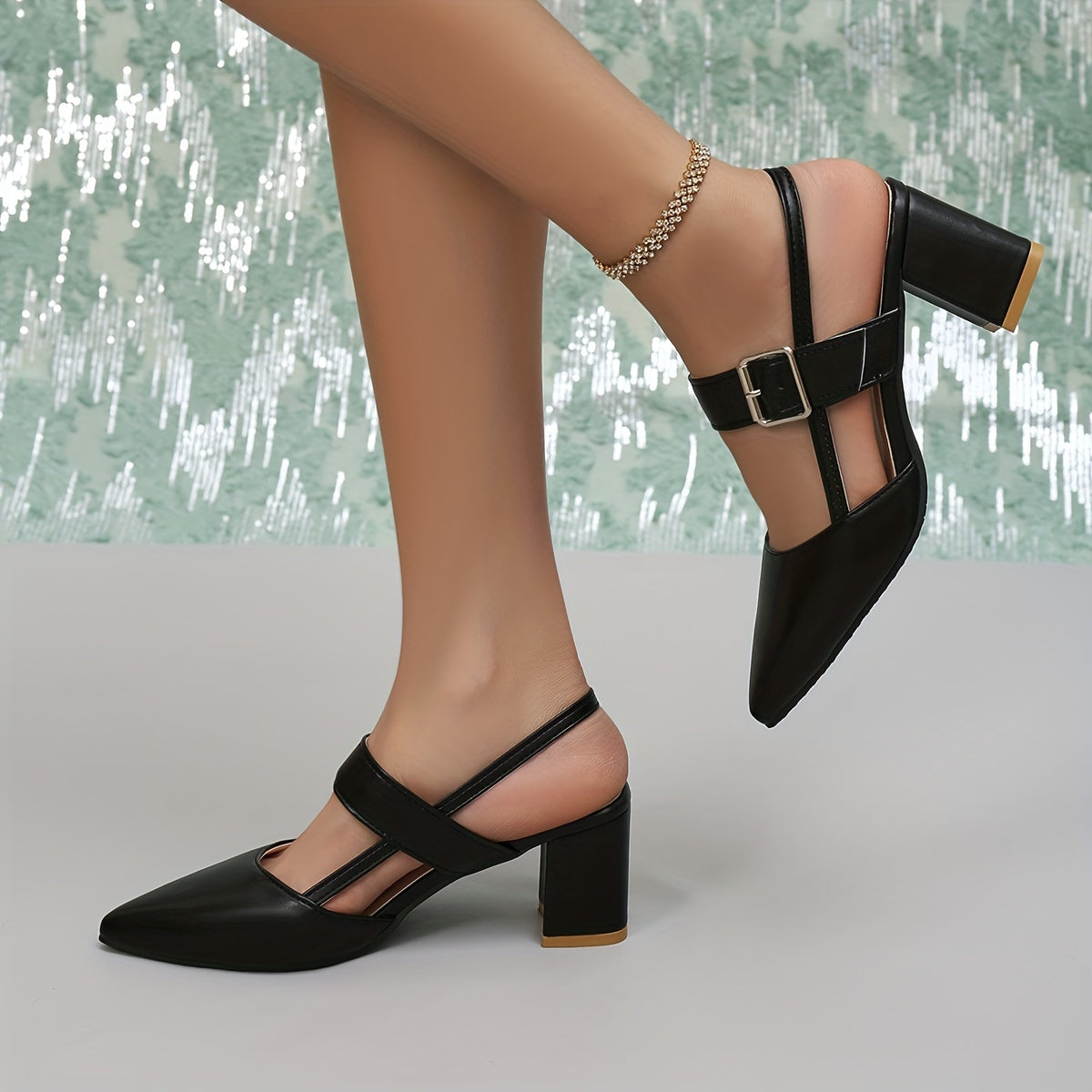 Women's black block heel sandals with pointed toe, slip-on style, and faux sole. Made from man-made materials, suitable for all-season fall footwear.