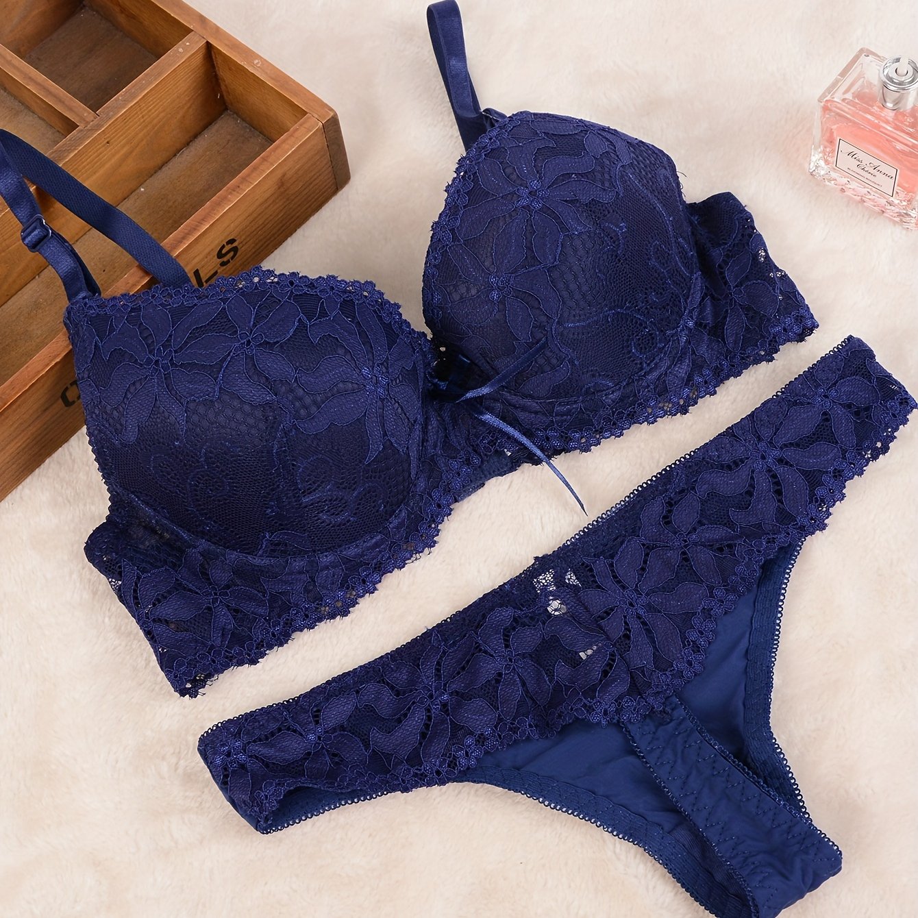 Luxurious black lace lingerie set for women includes push-up bra and matching thong with intricate floral design in comfortable, non-see-through nylon blend.