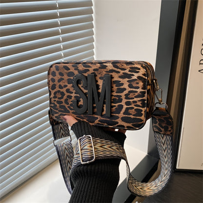 Leopard print PU crossbody bag with detachable strap in deep brown, perfect for casual or commuting outfits. Bold letter design on small shoulder bag.