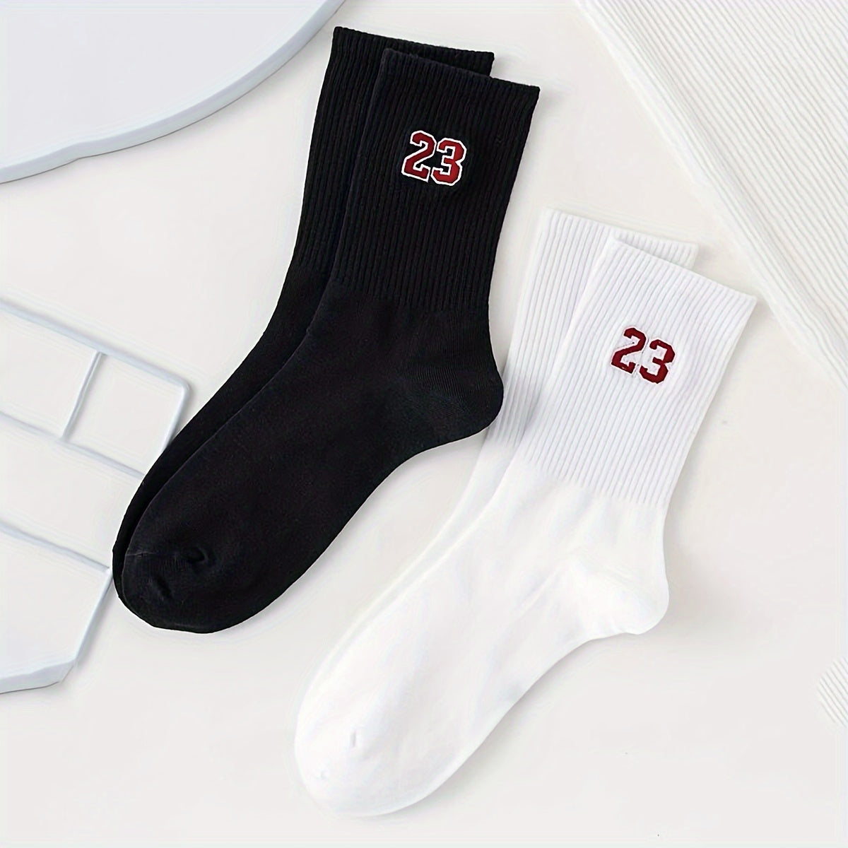 2 pairs of men's short crew socks with a 23 pattern design, breathable and comfortable for casual wear, sports, and outdoor activities.