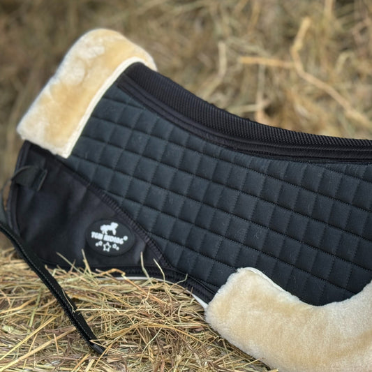 English saddle horse half pad with 100% woven fabric outer and shape-retaining foam insert, featuring a thick, soft, non-shedding synthetic sheepskin for easy cleaning.