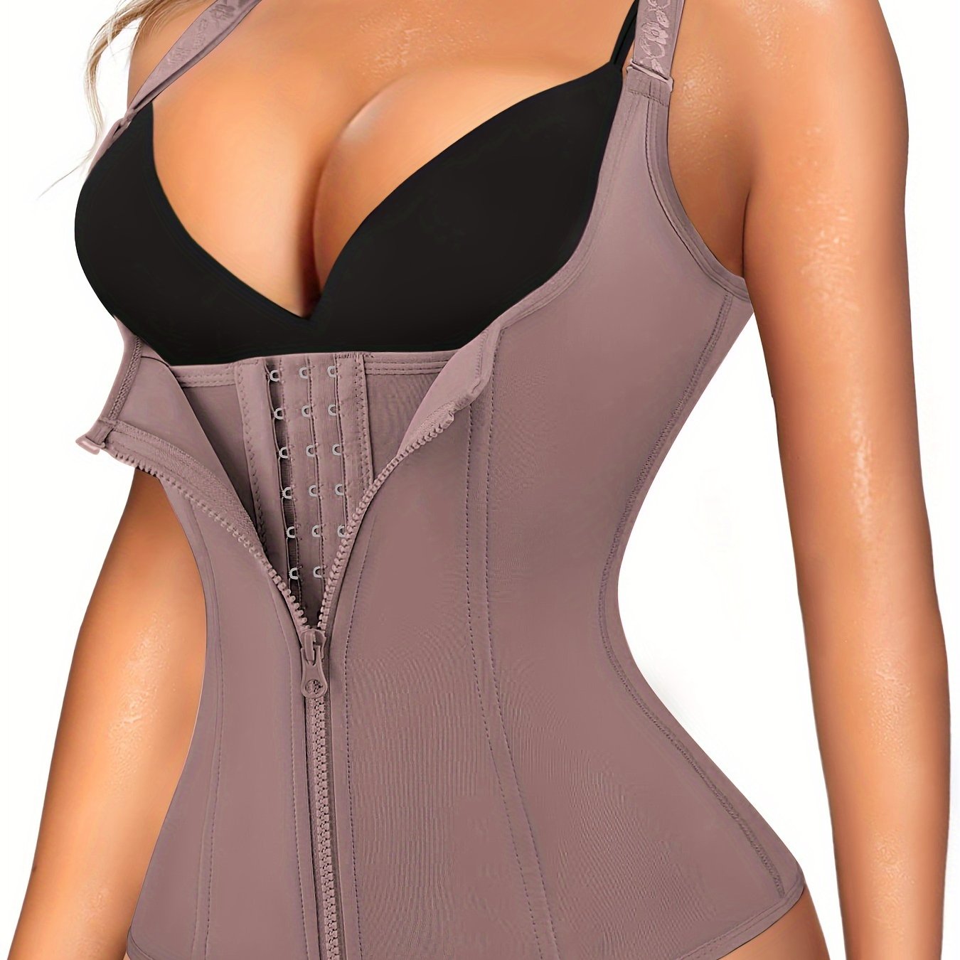 Enhance your curves and define your waistline with Junlan Women's Black Zipper Shaping Cami Top. This waist trainer features tummy control and open bust design for a slimming effect. Made