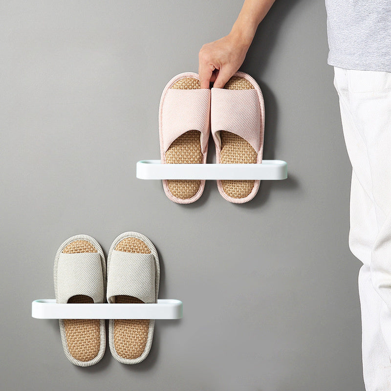 Wall-mounted bathroom slipper rack for 1 pair of shoes, designed without the need for perforation. This storage rack can hold single and double shoes, and is perfect for organizing your bathroom space.