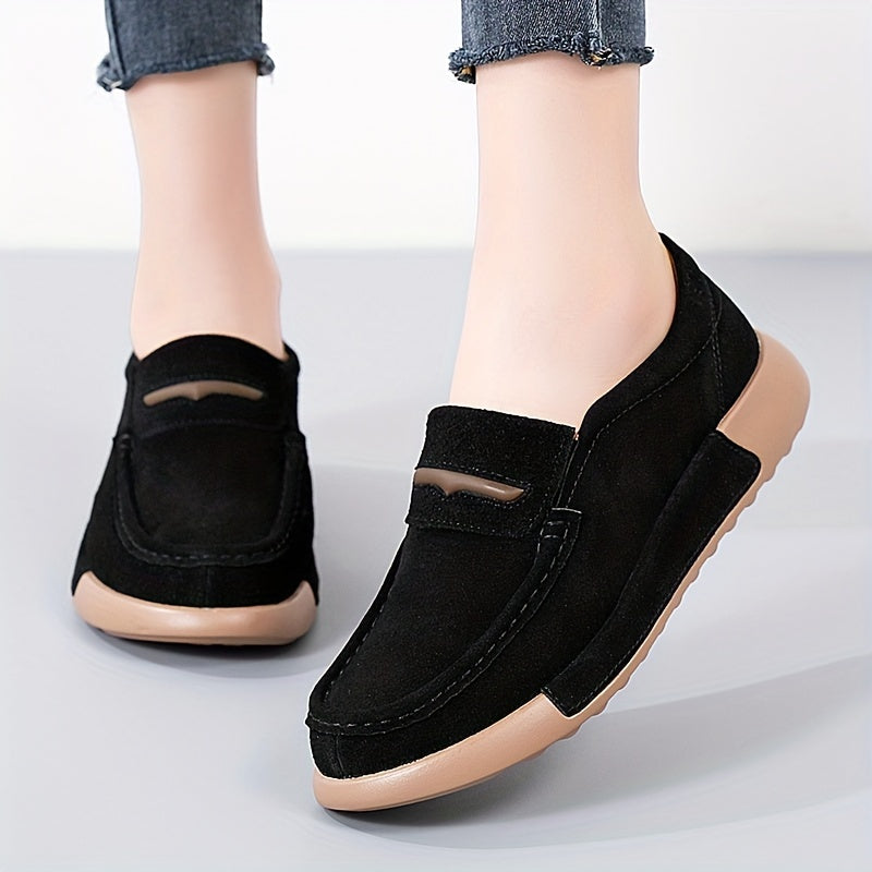 Women's slip-on loafers in solid color with round toe, casual low-top design.