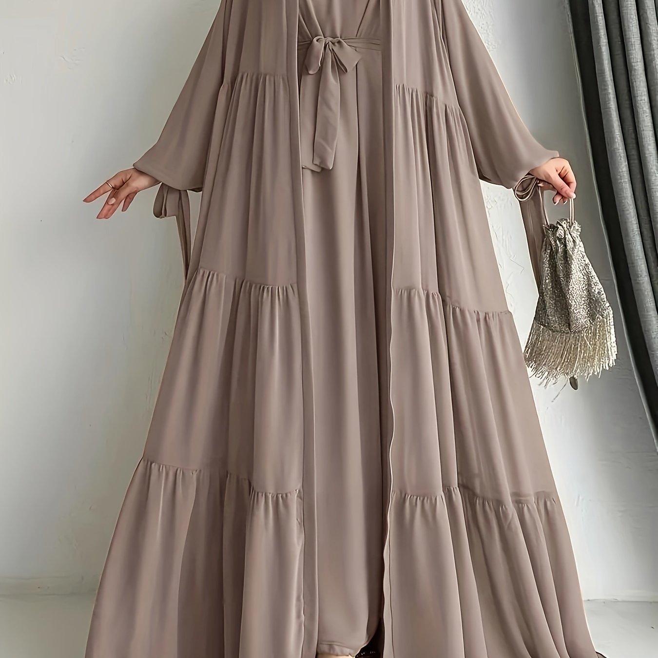 A stylish Middle Eastern Abaya set with vest and belt, featuring a chiffon H-Line robe with side split, lantern sleeves, and ruffle hem detail - perfect for all seasons.