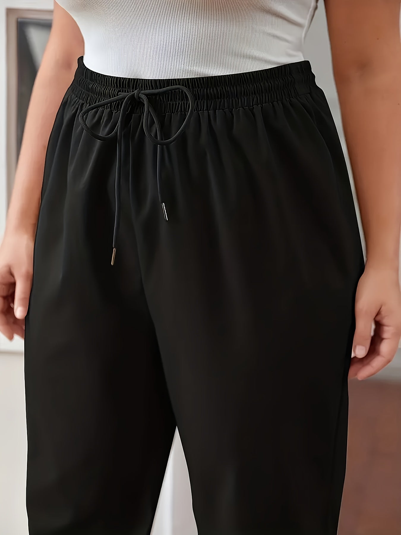 Solid fitted bottom joggers for plus size women, casual drawstring pants for spring and summer.