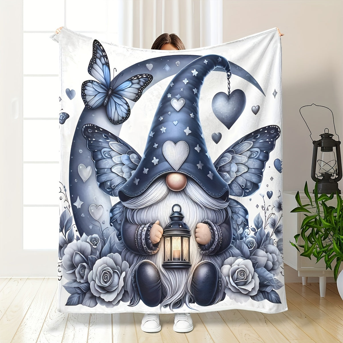 Soft, warm, and cozy, this flannel throw blanket features an enchanted gnome and butterfly print. Perfect for the couch, bed, office, or travel, this versatile all-season gift is sure to bring comfort and style to any space.