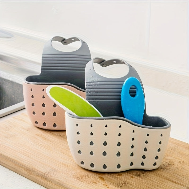 Introducing the BANUCHE Dual-Layer Sink Organizer - a versatile kitchen storage rack featuring heart-shaped handles, faucet hanging sponge, and utensil basket. Available in beige, gray, and blue, this durable plastic organizer requires no power and is