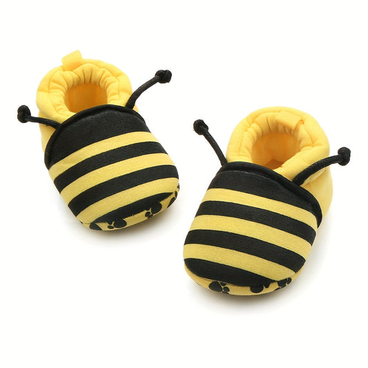 Baby slip-on walking shoes with cute bee cartoon design, fabric upper, cloth insole, and fabric sole suitable for all seasons.