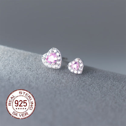 These stylish and versatile earrings are crafted from S925 sterling silver and feature sparkling zirconia in a heart-shaped design. Perfect for daily wear, gifting, or vacation, they have a silvery weight of 0.7-0.5g.