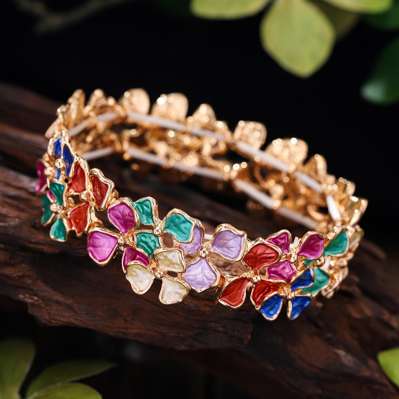 Elegant and timeless, this colorful enamel flower bracelet is made of high-quality zinc alloy. It is designed for women and features a fashionable stretch bangle style that is 18K golden plated. Perfect for daily wear, parties, and holidays, this