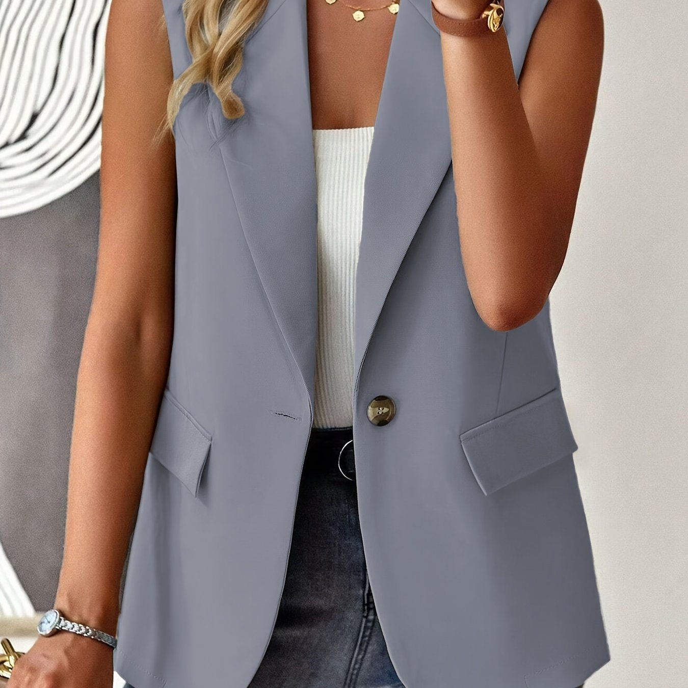 Sleeveless button front lapel vest in a solid color, suitable for spring and fall. Ideal for women's clothing.