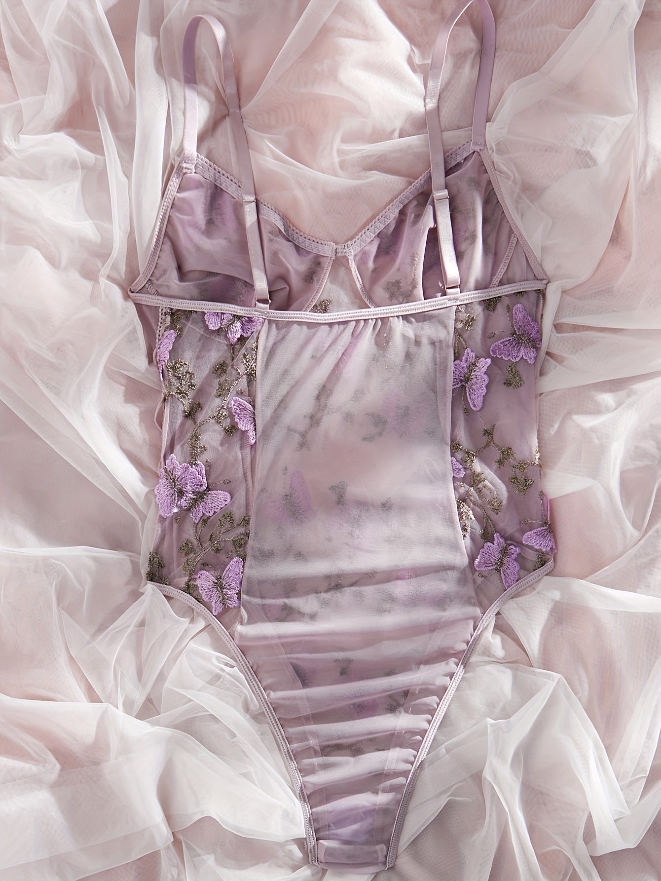 Purple butterfly embroidered teddy bodysuit with deep V-back, thong bottom, sheer mesh, hand washable, for women.