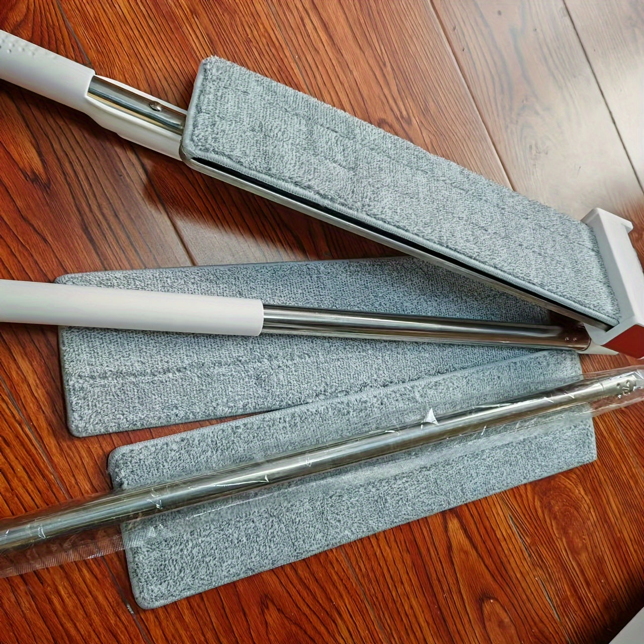 This Stainless Steel Flat Mop with a 180cm Long Handle offers hands-free washing, a durable rotating design, and can be used for both wet and dry cleaning. It comes with 3 reusable pads and is perfect for cleaning in the living room, bedroom, bathroom