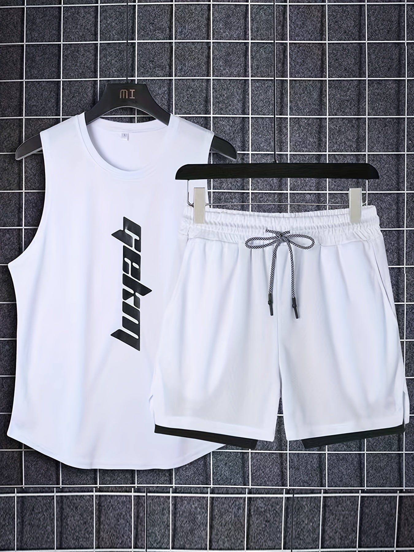 Men's 2-piece outfit with letter print tank top and loose basketball shorts.