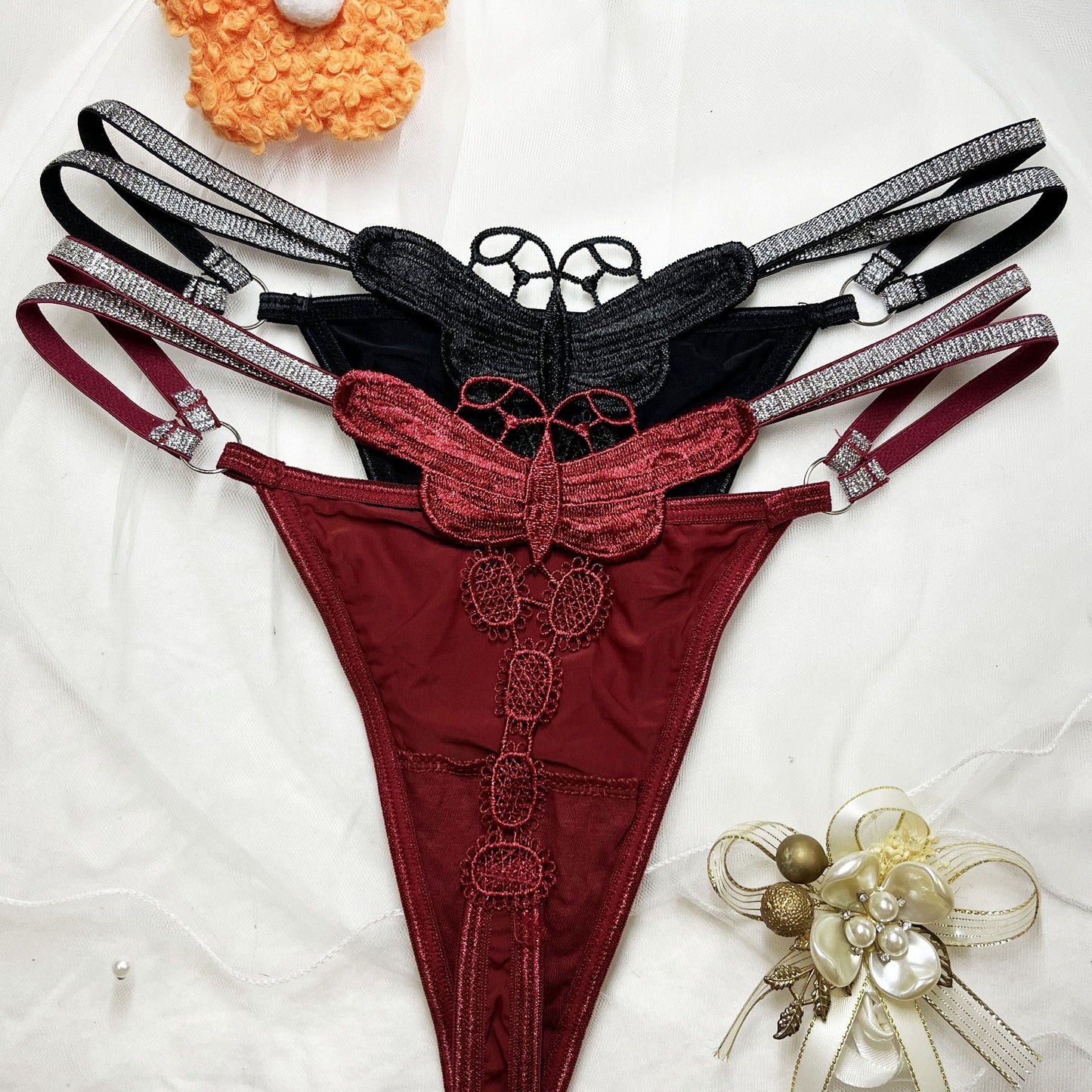 Glittery butterfly embroidered thong pants in two colors with a thin belt