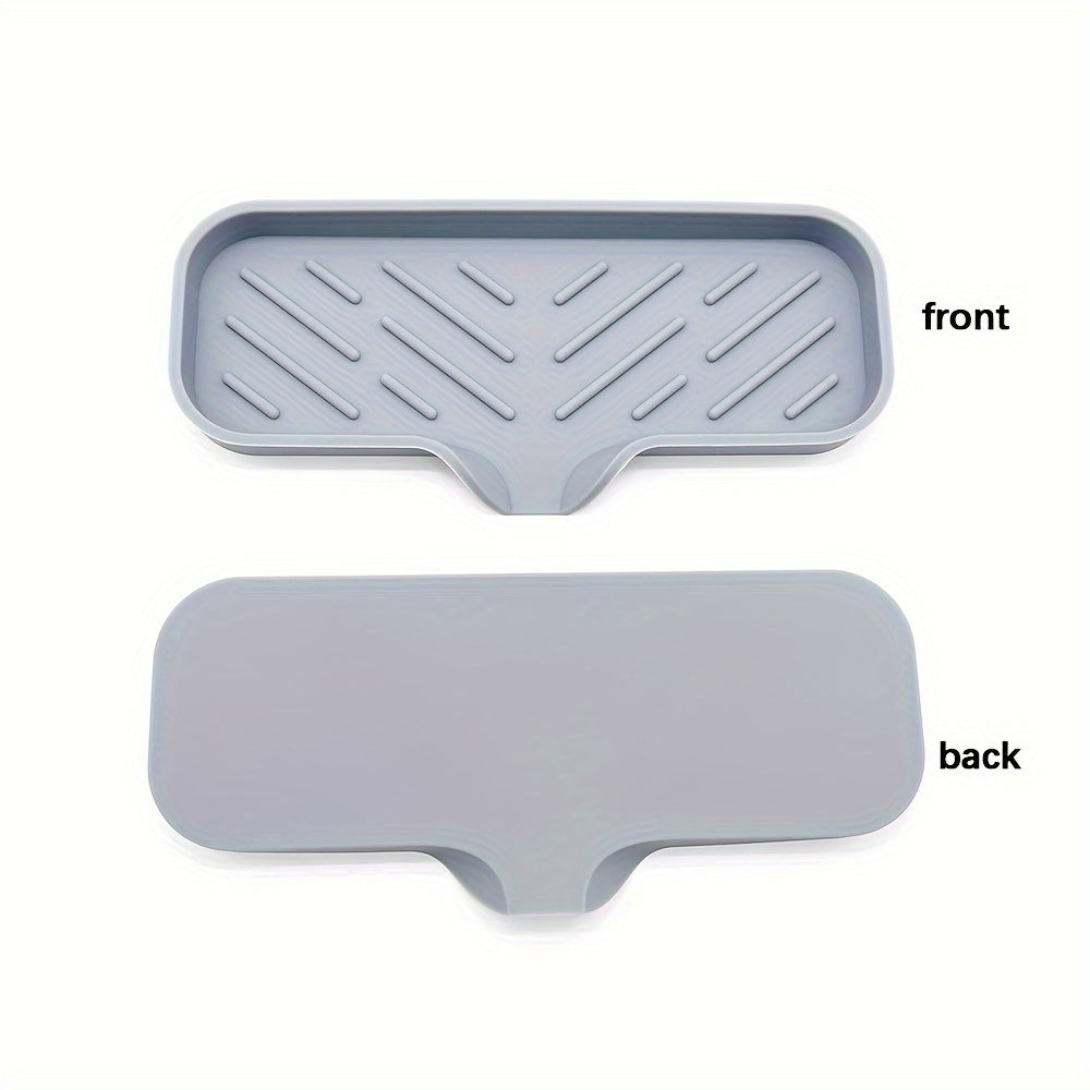 Silicone soap dish with self-draining tray for kitchen or bathroom sink, also functions as a non-slip sponge holder and soap saver pad.