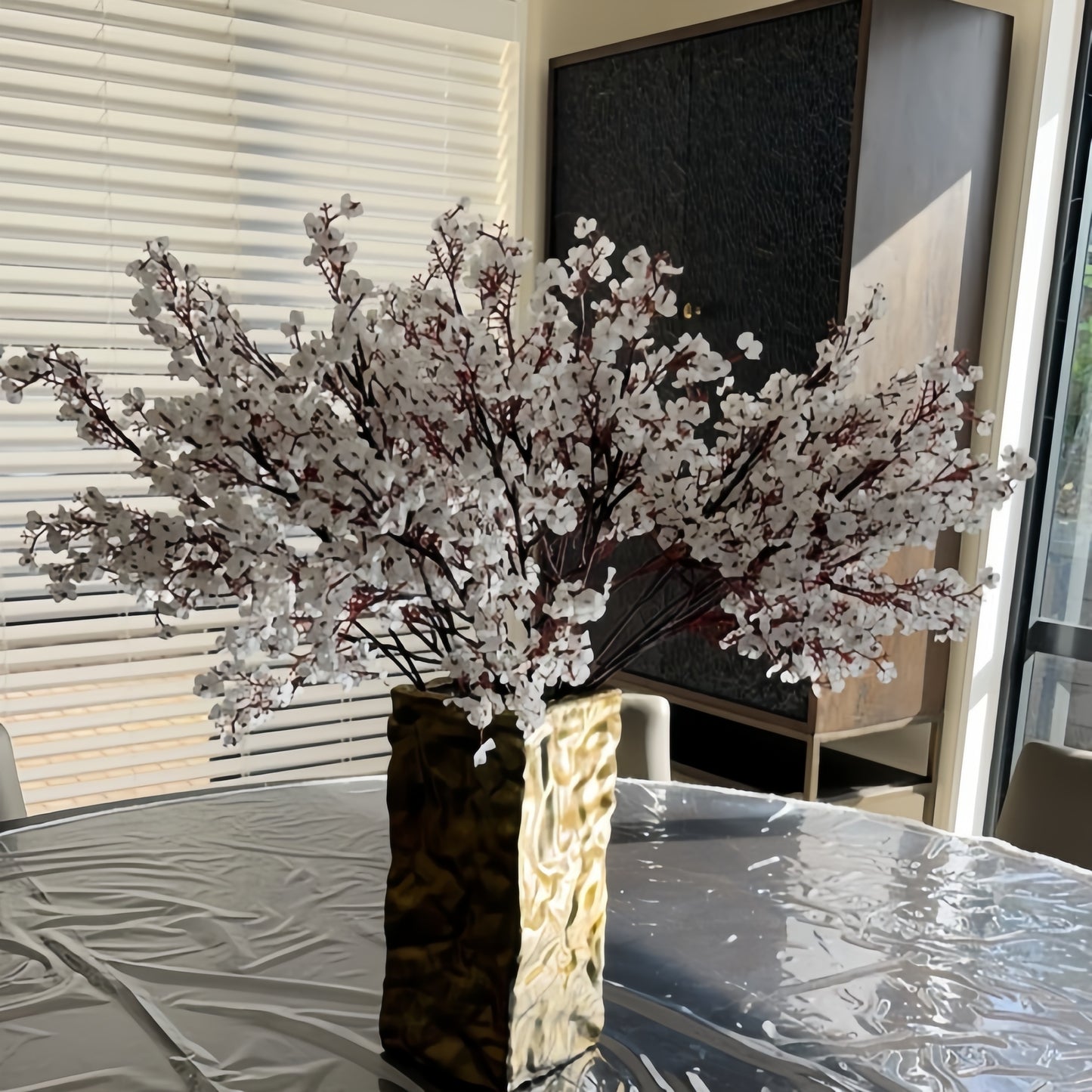 Artificial baby's breath bouquet with 10 stems, perfect for weddings, home decor, and holiday parties. Container not included.