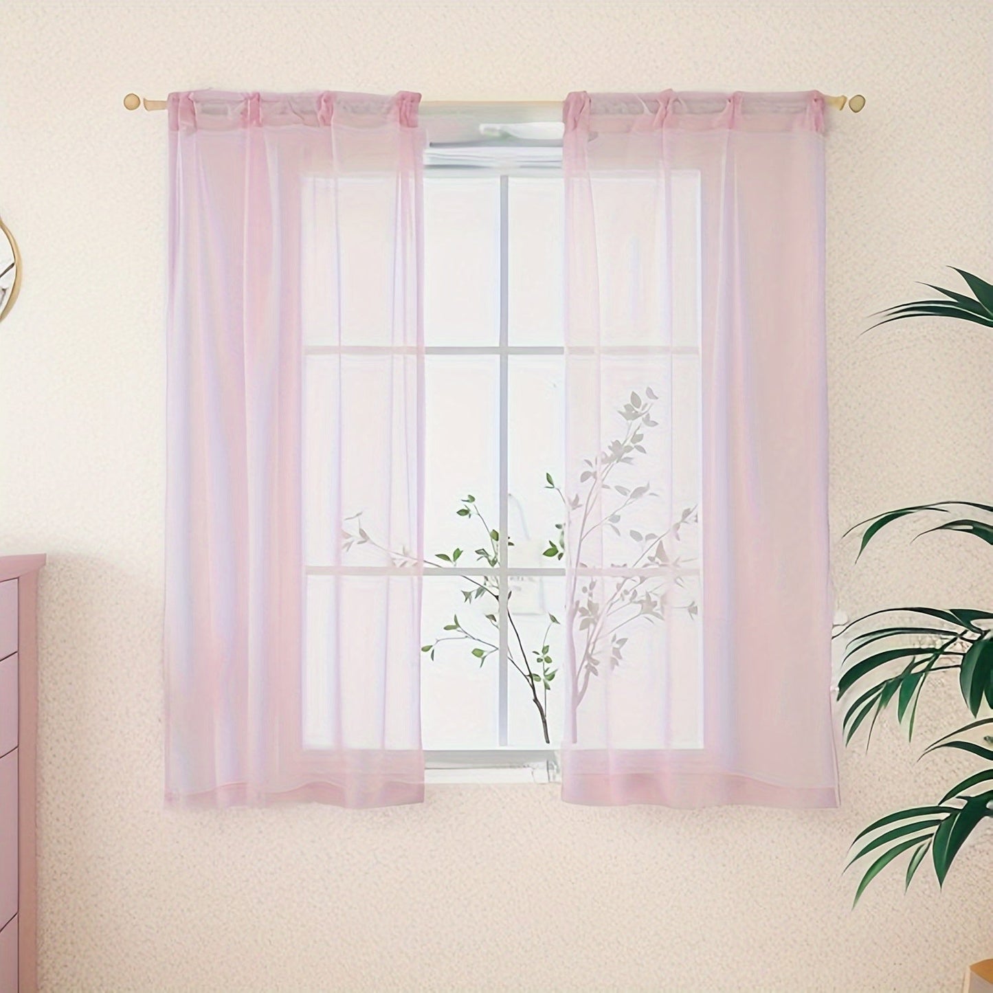 Two panels of sheer curtains with a basic rod pocket design, perfect for adding a touch of elegance to your bedroom, office, living room, yard, kitchen, or any other space in your home.