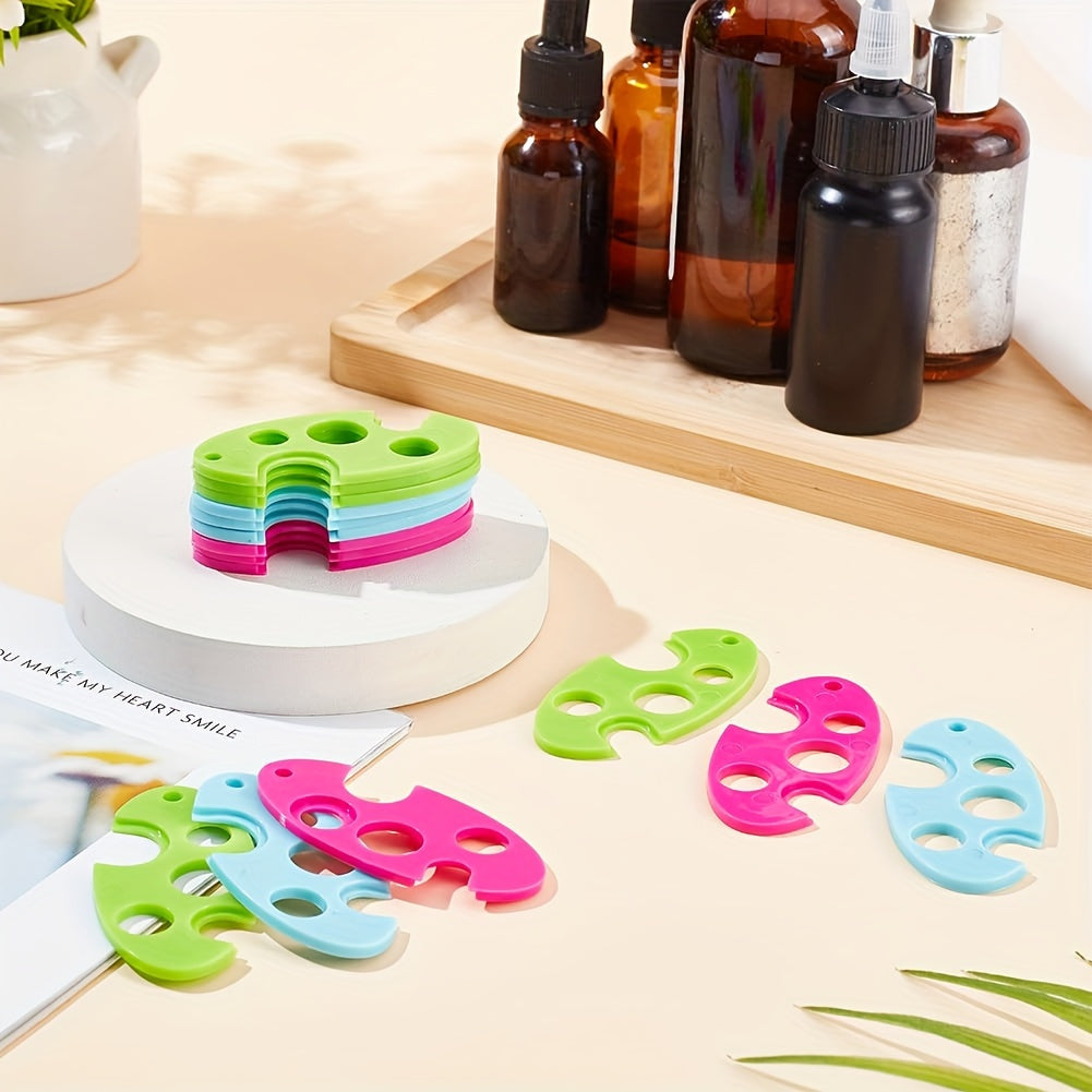 Durable tool for easy removal of essential oil bottle caps - colorful plastic opener with roller ball.