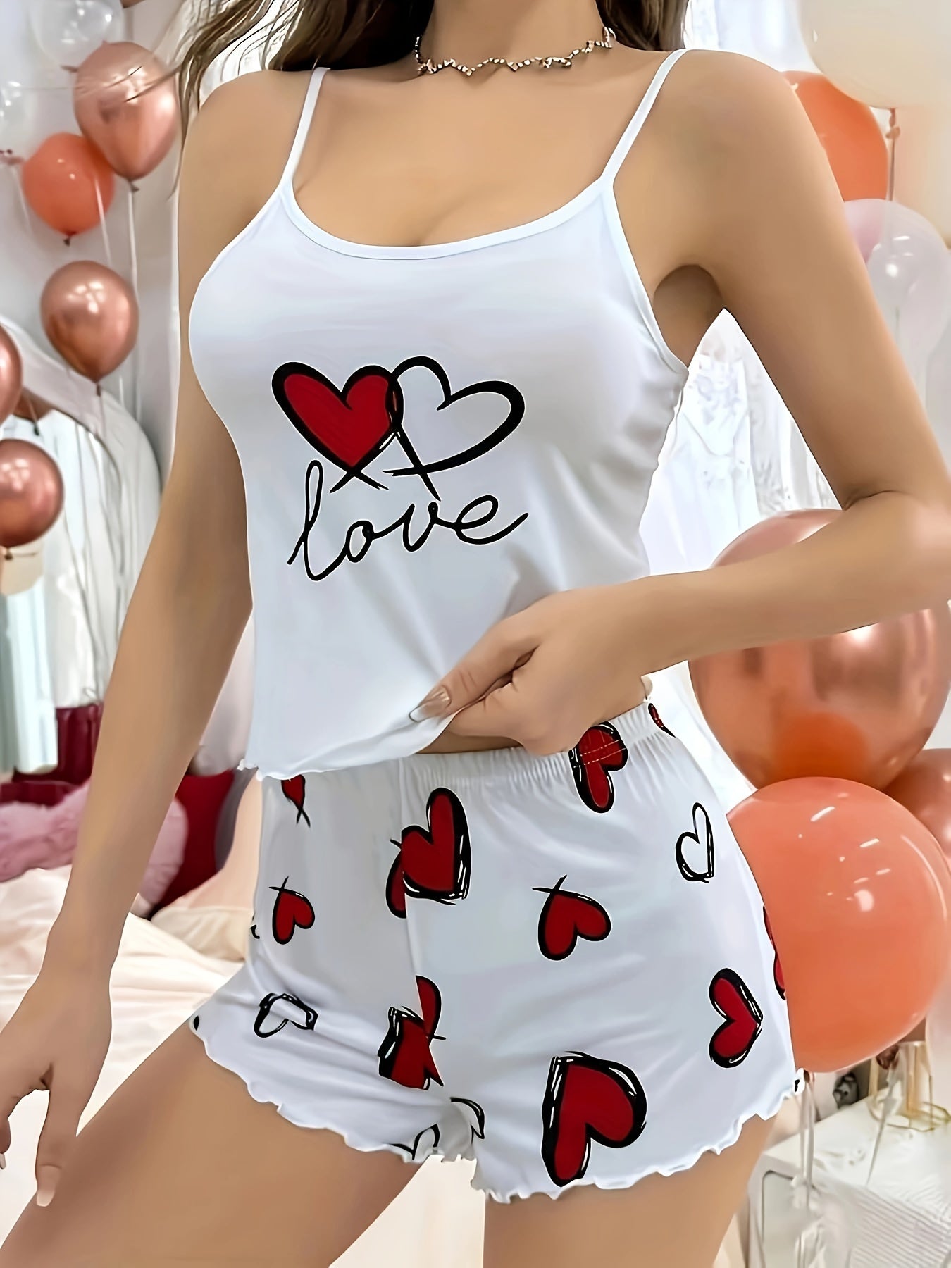 Frill-trimmed pajama set with heart and letter print, including a round neck backless cami top and elastic shorts for women's sleepwear.