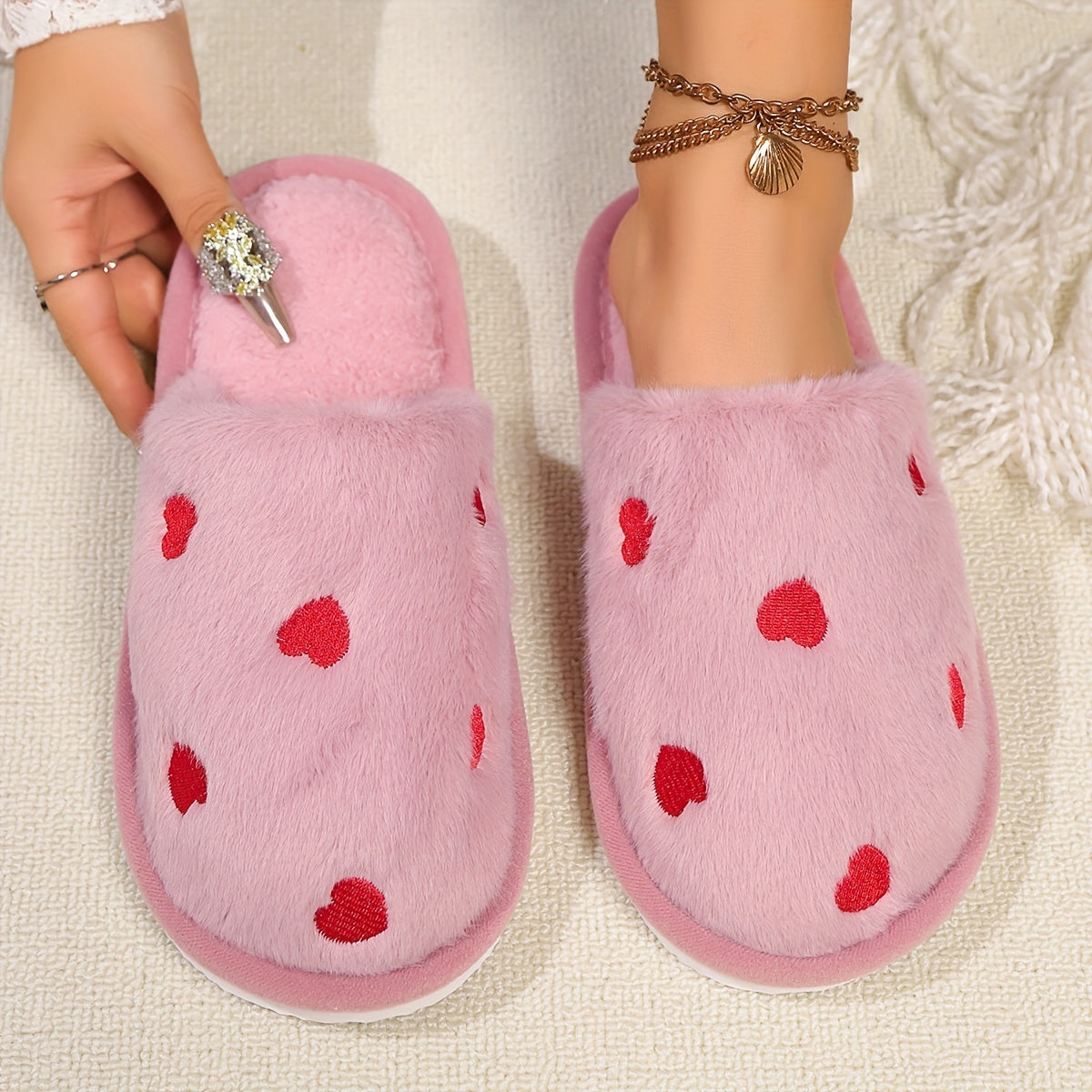 Soft and warm women's winter slippers with heart pattern - cozy and cute design, non-slip sole, hand washable, available in black, white, pink.