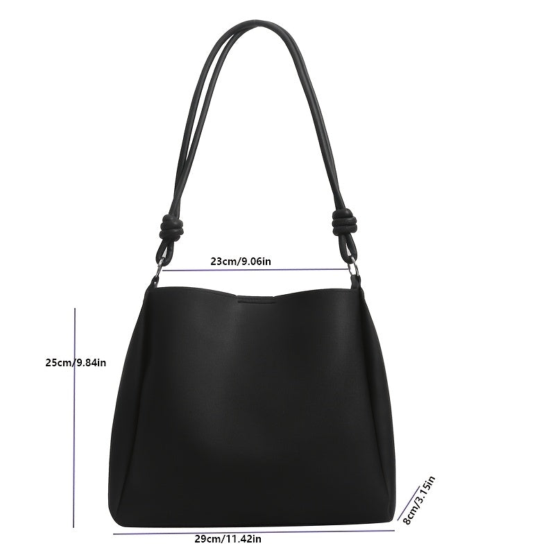 Chic black tote bag for women, ideal for commuting or daily use. Can be worn as a shoulder or crossbody purse with secure clasp closure.