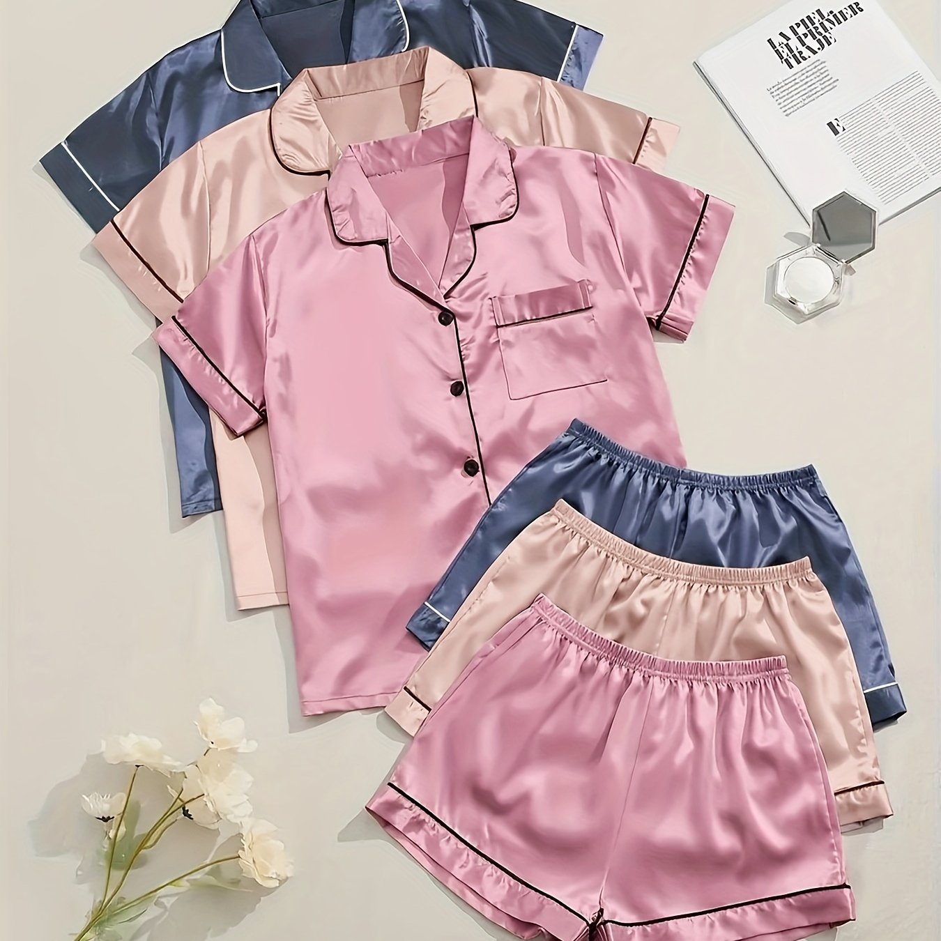 Solid satin pajamas with short sleeve button top and elastic shorts for women's sleepwear.