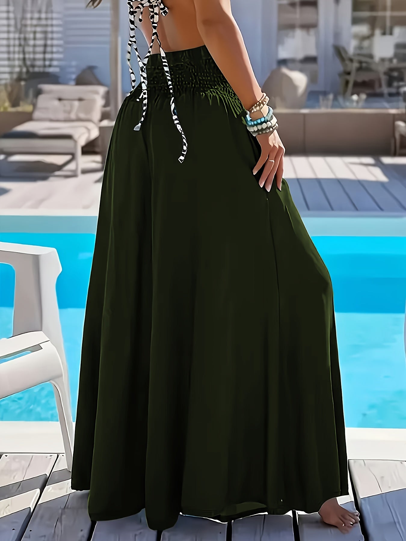 Plus size women's high-waisted wide leg pants in solid green polyester with tassel detail, perfect for comfortable casual outings.