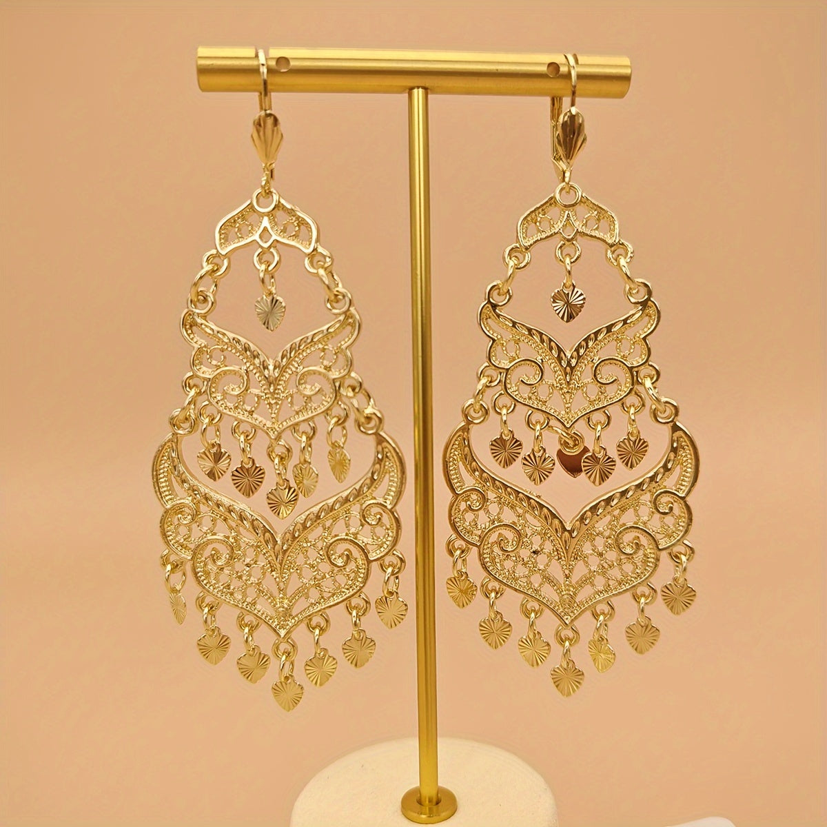 Pair of women's fashion earrings with retro large tassel and long dropping metal hollow design, perfect for banquet and festival celebrations inspired by Middle Eastern fashion.