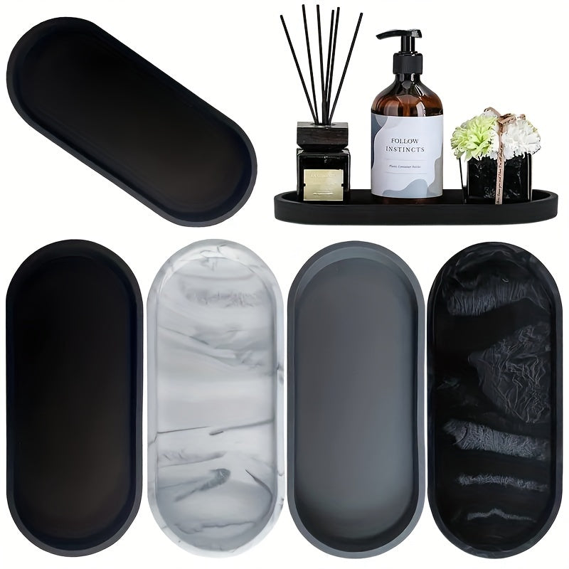 Black silicone vanity tray for organizing toiletries, perfume, and jewelry with artistic patterns, sleek design, and durable construction. Perfect bathroom decor accessory.