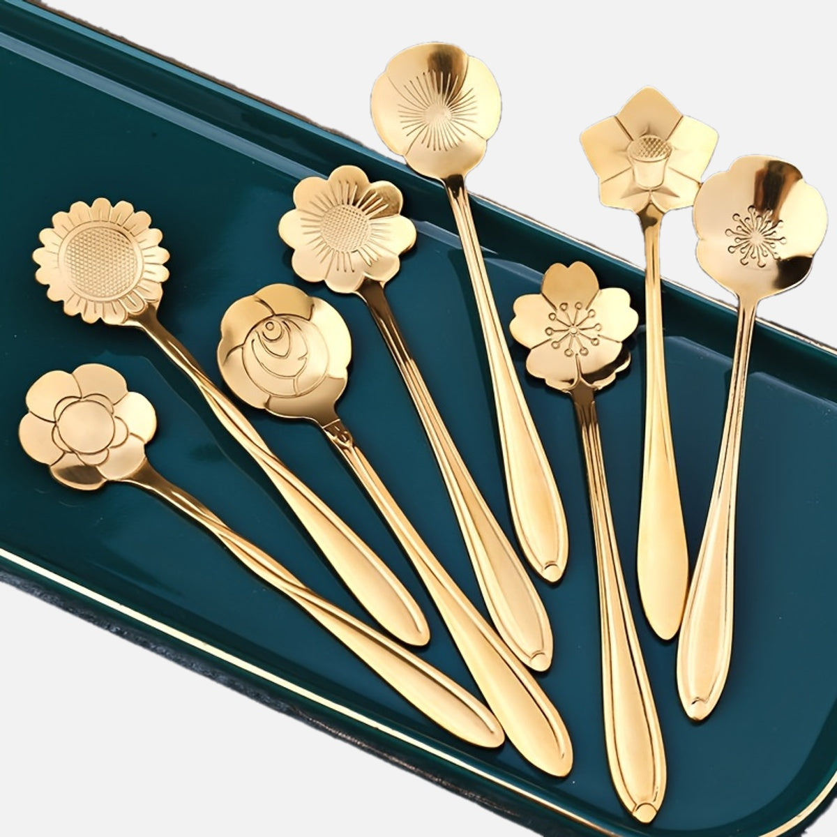 Four stainless steel cherry blossom coffee/dessert spoons.