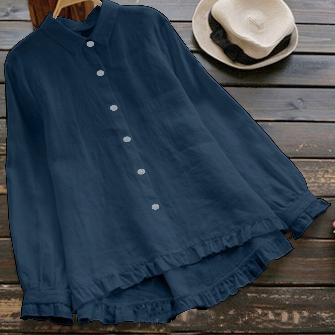 Loose-fitting collared shirt in solid color with front buttons and lace trim.