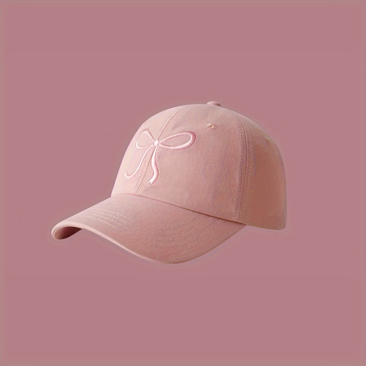 Adjustable bowknot baseball cap in sweet pink design, made of lightweight polyester. Comes in black, grey, apricot, and pink for casual wear.